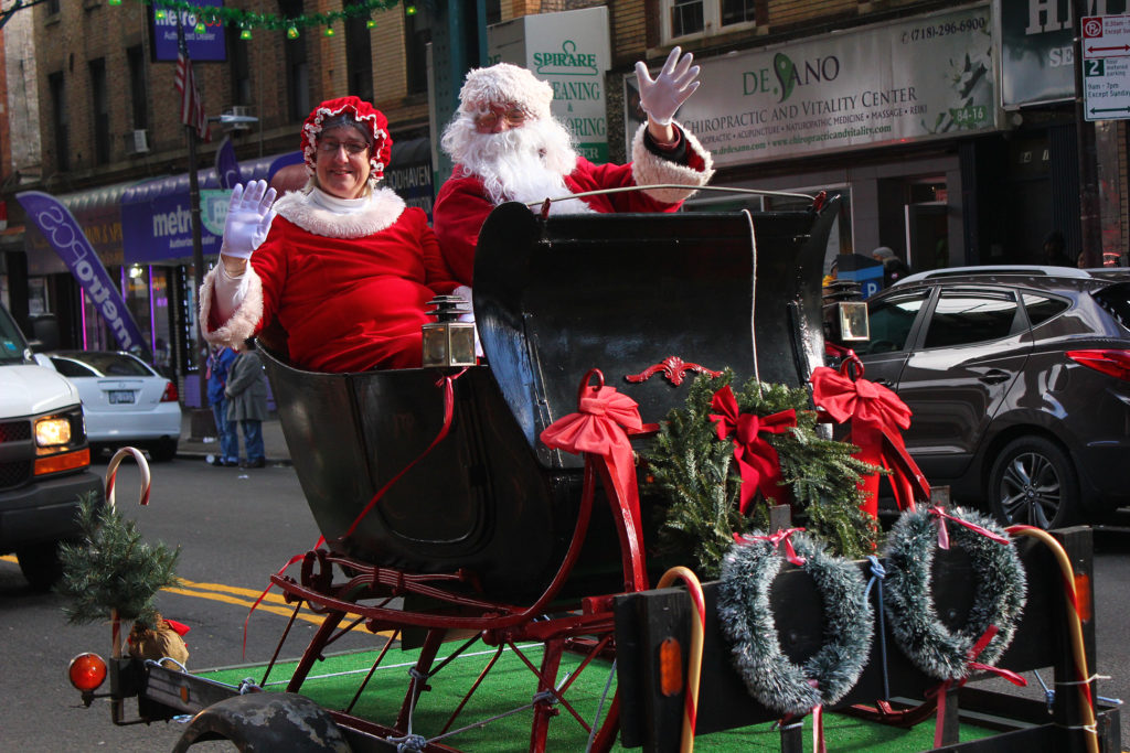Santa Claus and his wife Mrs. Claus ride their sleigh along Jamaica Avenue during the Welcome Santa to Woodhaven Parade on Dec. 3.