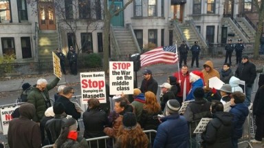 Maspeth protesters change tactics on shelter, rally at Banks’ home