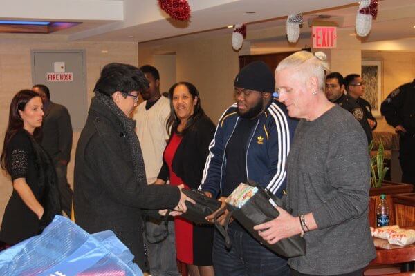 Maspeth youth provide gifts to homeless men living at controversial hotel