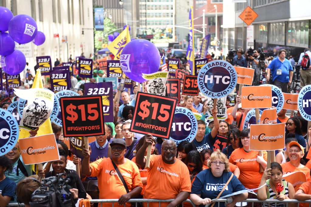 Local worker unions have been championing for a $15/hour minimum wage for years; New York state will have it as early as 2018.