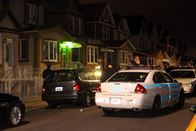 Police investigate the scene of the city's first homicide of 2017 in Richmond Hill early on Monday morning, Jan. 2.