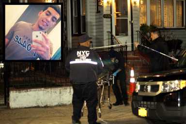 Workers remove body of 24-year-old Efrain Vargas from his home at 89-28 91 street in Woodhaven where he was found dead with trauma to the body.