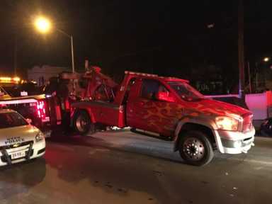 A tow truck is towed away during an illegal parking crackdown conducted by the 104th Precinct in Maspeth on Feb. 2-3, 2017