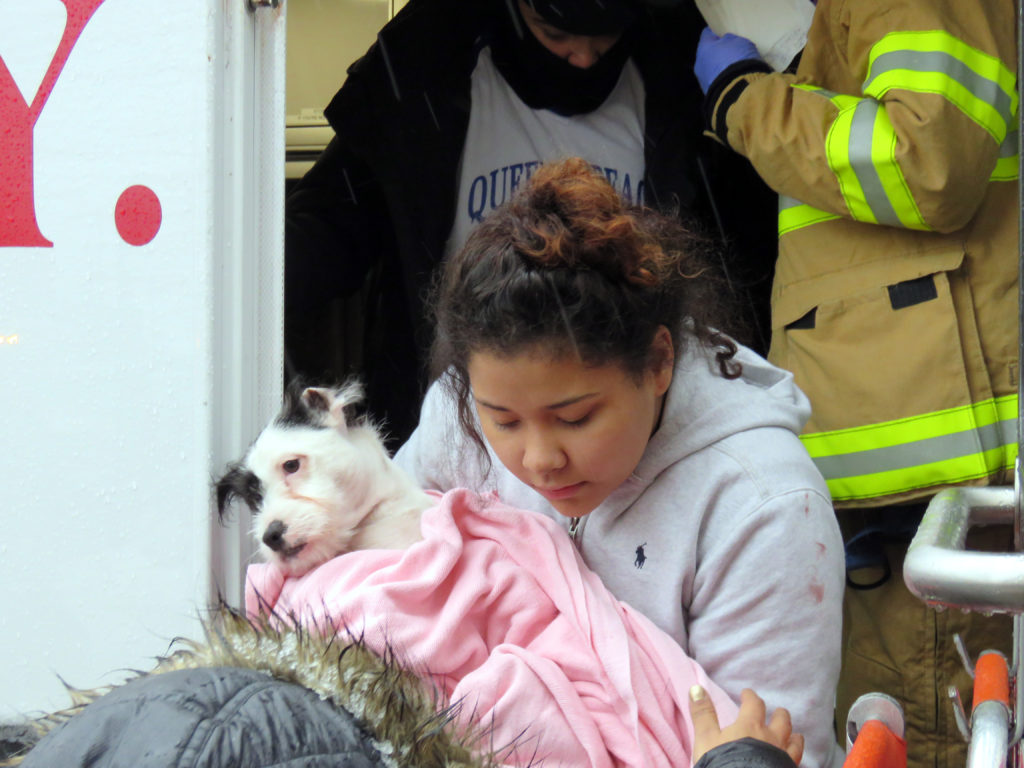 16 year old Adrianna Rosa and her sisterGianna Rosa age 10 after being checked by ems at the fire located 56-14 Waldron st. in corona Queens , the kids alond with the pets had to jump from the second floor and were caught by the building super Roberto Flores. Photos by Robert Stridiron. 02/12/17