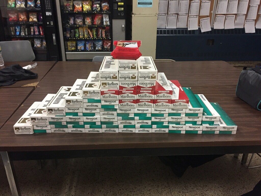 A pyramid of untaxed cigarettes seized in a previous police operation.