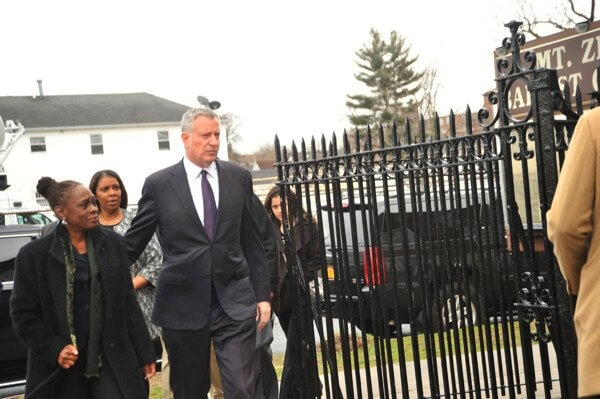 Mayor decries hate at Caughman funeral