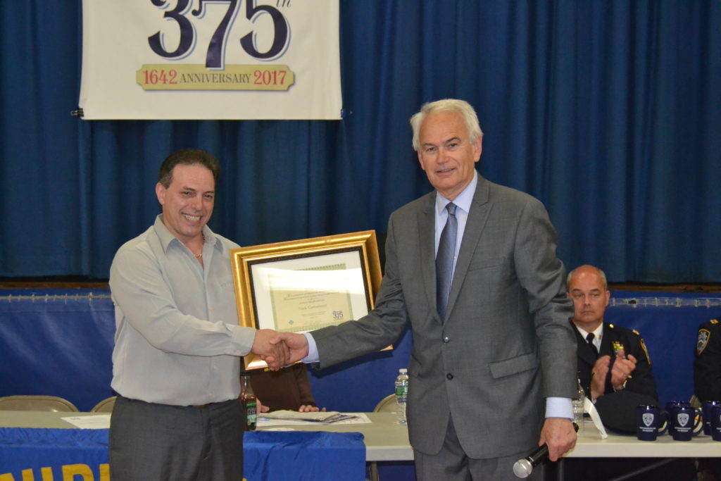 JPCA president Robert Holden presenting CEC24 president Nick Comaianni with a community service award.