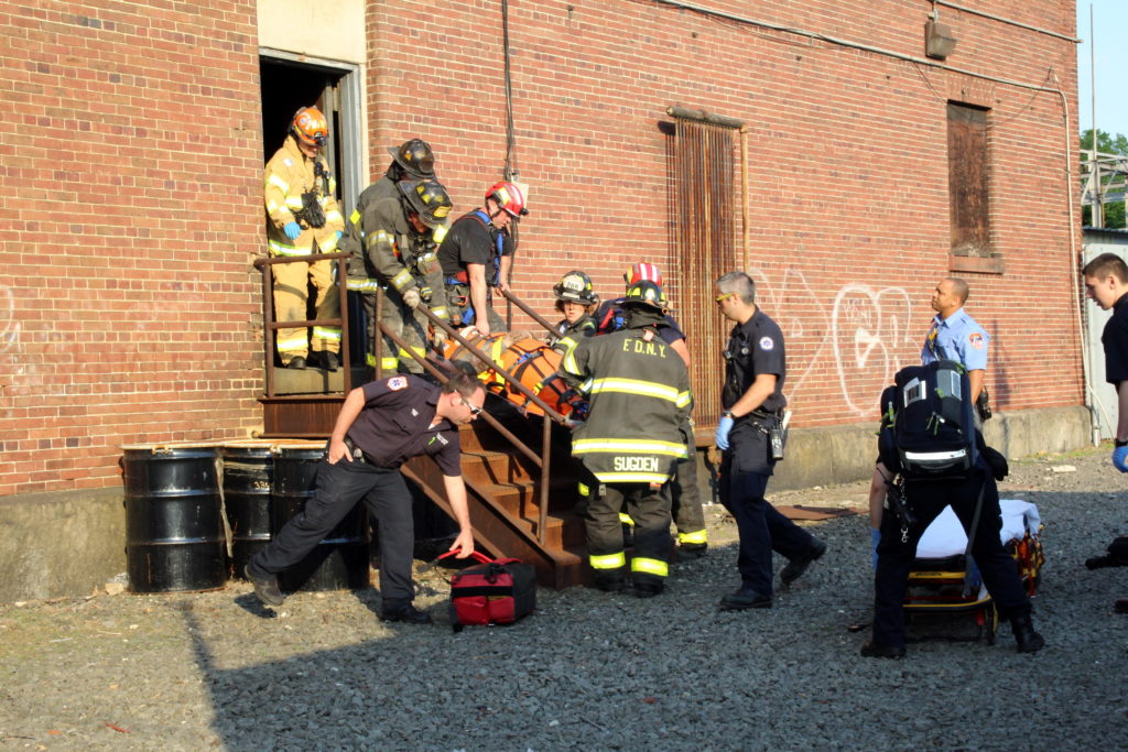 Members of FDNY Squad Company 270 and paramedics rescued a 15-year-old boy who fell down a hole at an abandoned LIRR power station on June 10.
