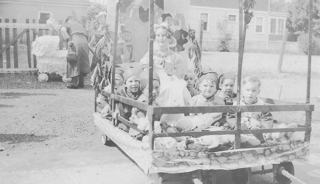 Children ride at a float during a 20th century Woodhaven Anniversary Day Parade.