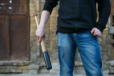 shutterstock_man with bat