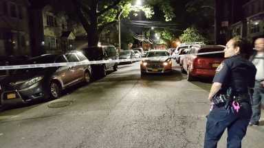 Police at the scene of a home invasion in Corona on June 1.