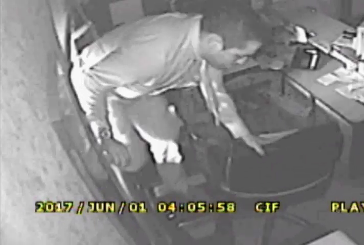 The suspect burglar climbing through the open window of a Forest Hills dentist's office during a burglary on June 1.