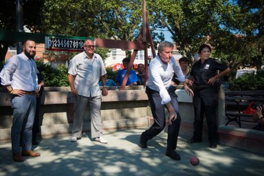 Mayor Bill de Blasio and New York State Assembly Member Francisco Moya walk through Corona, Queens where they stopped to play bocce ball and enjoy an ice from the The Lemon Ice King of Corona on the second day of City Hall In Your Borough on Tuesday, July 18, 2017. Michael Appleton/Mayoral Photography Office