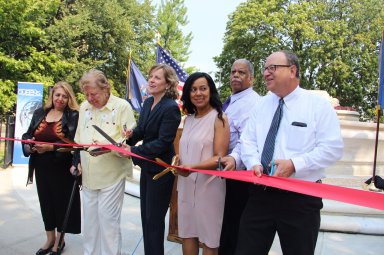 Queens Borough President Melinda Katz (fourth from right) and former Borough President Claire Shulman helped cut the ribbon on the new Women's Plaza in Kew Gardens on Aug. 22.