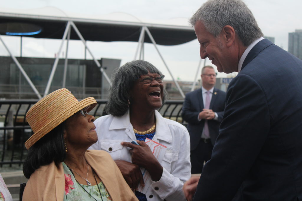 Jerlene Fitzgerald (left) and Claudia Kroger speak with Mayor Bill de Blasio at the 34th Street ferry stop. 