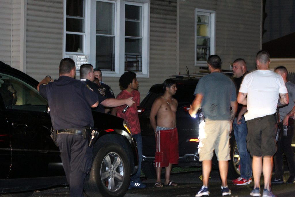 Several people in handcuffs at the scene of the multiple stabbing on 115 street and Liberty ave last night, the stabbing victims were across several blocks of Queens. Photos by Mari Estrella. 08/13/17