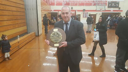 Flushing native returns to coaching after health scare