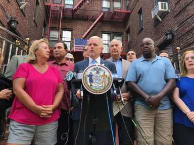 Sunnysiders rally at building filled with Nazi, racist images