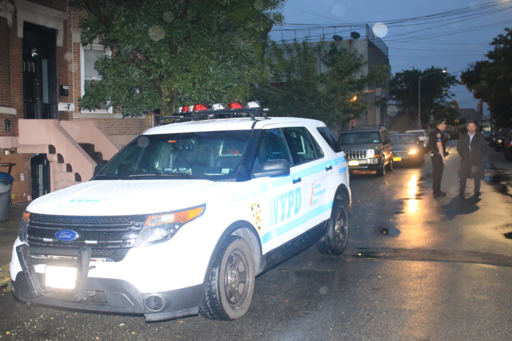 Officers at the scene of a deadly assault on what turned out to be a Ridgewood street on the morning of Sept. 3.