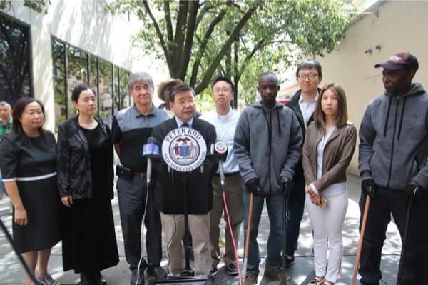 Koo adds two new sanitation workers in downtown Flushing