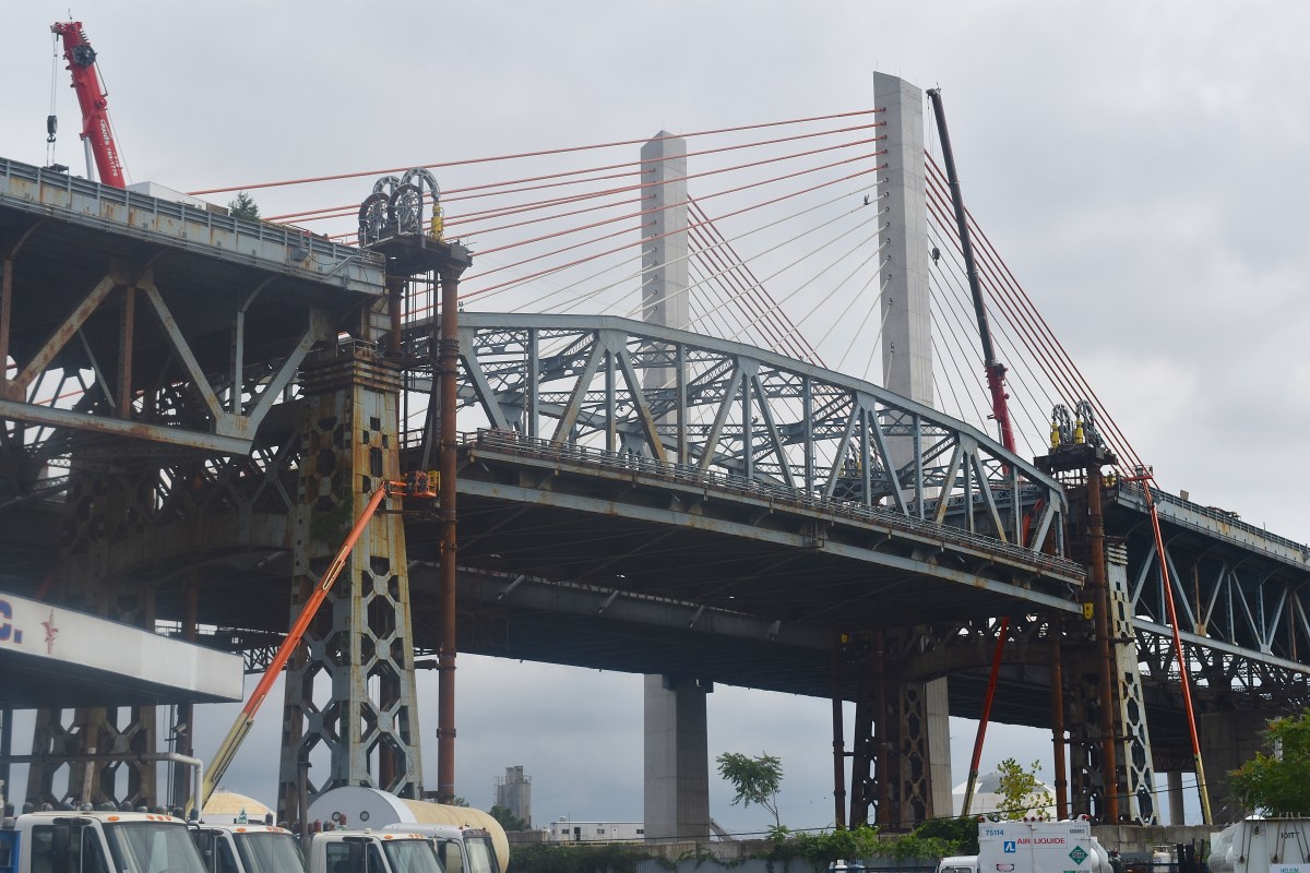 After the main span of the old Kosciuszko Bridge was lowered and barged away in July, crews will implode the bridge approaches on Sept. 24.