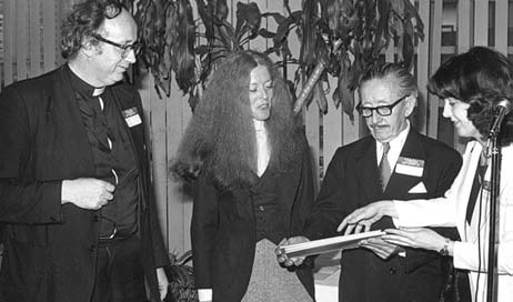 Monsignor James Kelly (left) pastor of St. Brigid Church, is pictured with Maureen Walthers and Carl Clemens of the Ridgewood Times in 1978 being honored for their seven-part series, "The Agony of Bushwick."
