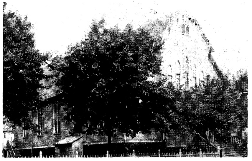The original St. Brigid Church exterior (we apologize for the grainy quality, as the original photo was not available). 