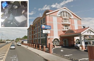 A bandit wearing a clown mask helped rob the Comfort Inn hotel in Maspeth on Oct. 19.