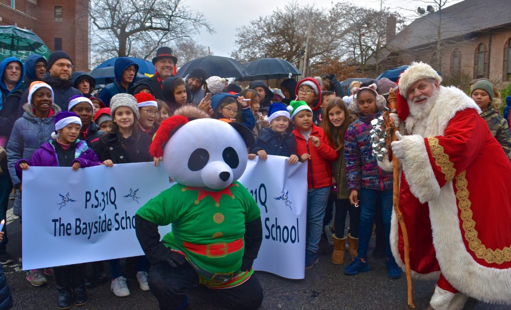 City Councilman Paul Vallone and students from P.S. 31 in Bayside welcomed Santa Claus to the Bayside Children's Parade and Tree Lighting on Dec. 3.