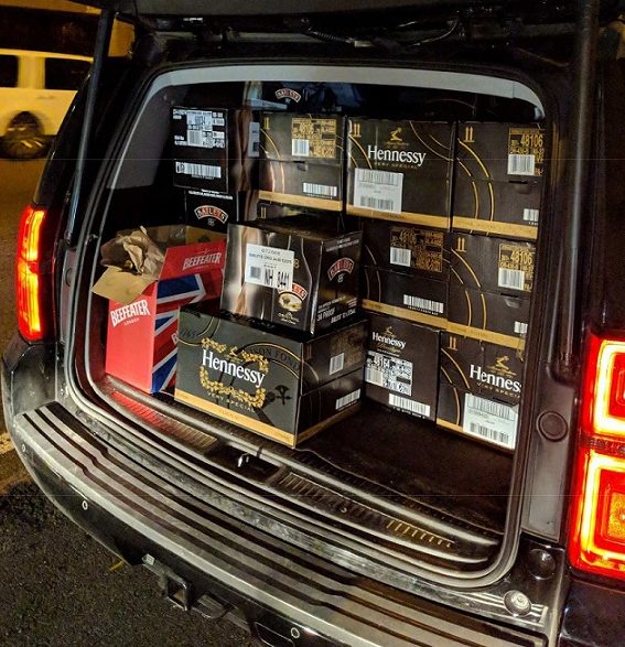 Liquor cases are pictured in the trunk of a vehicle driven by Flushing resident Juncheng Chen.