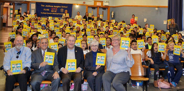 Dromm, civic association distribute Jackson Heights history books to students at PS 69