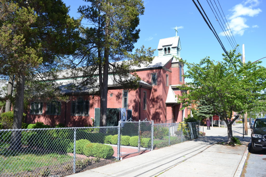 Before Sacred Heart Church’s permanent home was constructed on 78th Avenue in Glendale, as pictured above, the parish’s first years were celebrated at the former Emerald Park picnic grounds on Myrtle Avenue off 88th Place. As it happened, the park would later become the site where St. John’s Lutheran Church erected its house of worship. (photo: Robert Pozarycki/QNS)