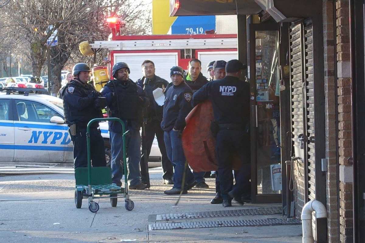 Police officers gathered outside an apartment building in Glendale during a Jan. 13 standoff.