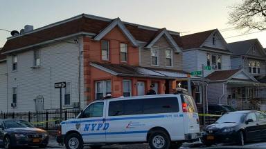 Police secure the 103rd Avenue home in Richmond Hill where a 26-year-old woman was found fatally stabbed on Jan. 1.