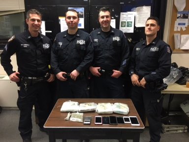 Officers from the NYPD Strategic Response Group stopped two men with a large amount of cocaine inside a car in Richmond Hill on Feb. 21.