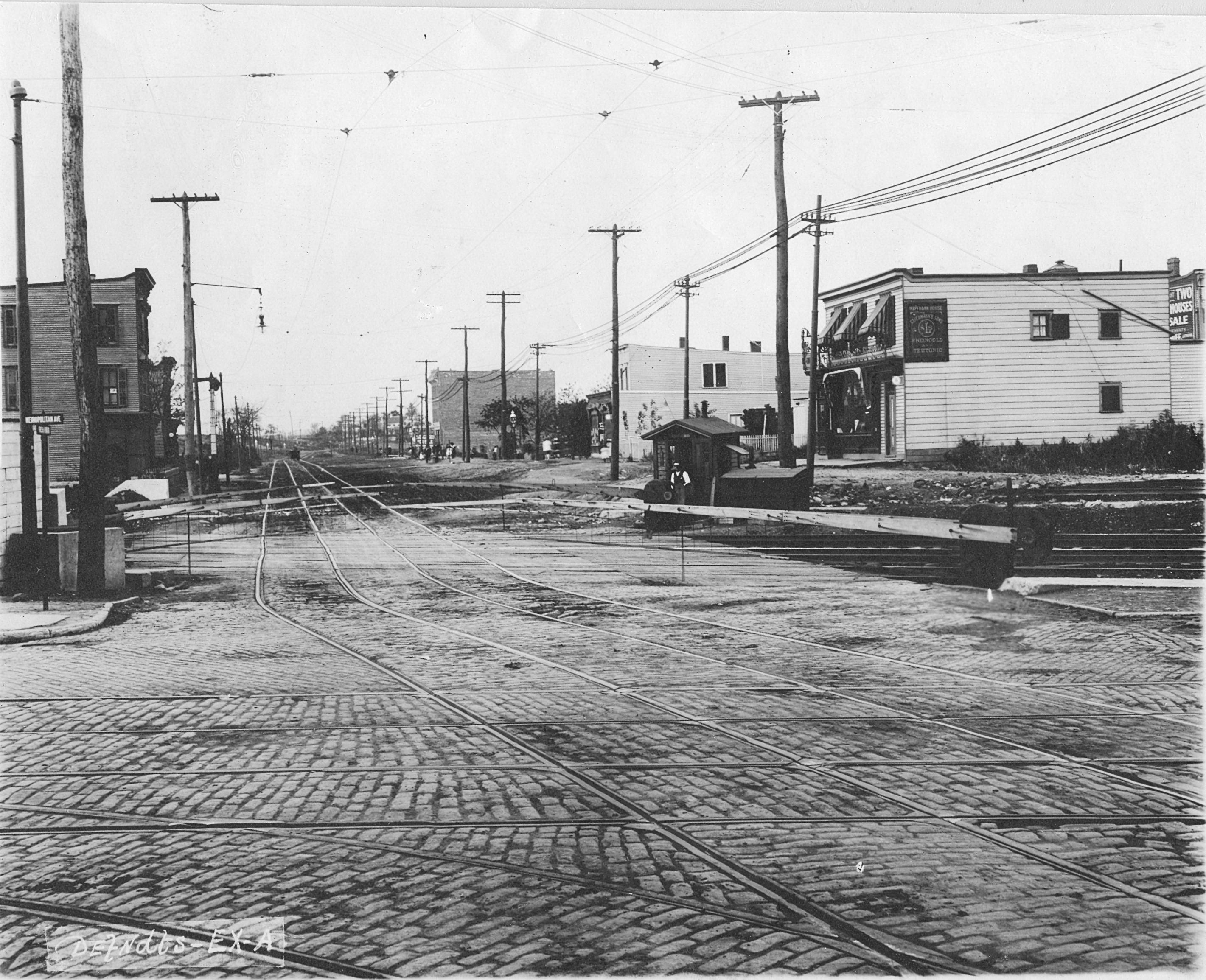 The cobblestoned intersection of Fresh Pond Road and Metropolitan Avenue in this early 20th-century photo.