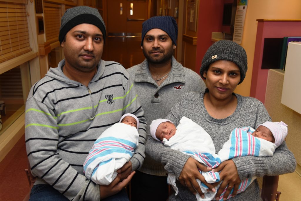 Proud parents of baby triplets Manjinder Singh and Navdeep Kaur are joined by dad's brother, Harpreet Singh, as they cradle their newborn daughters while still at NYC Health + Hospitals/Queens, where the babies were delivered. The triplets were transferred to the NICU for several weeks until they were healthy enough to be discharged.