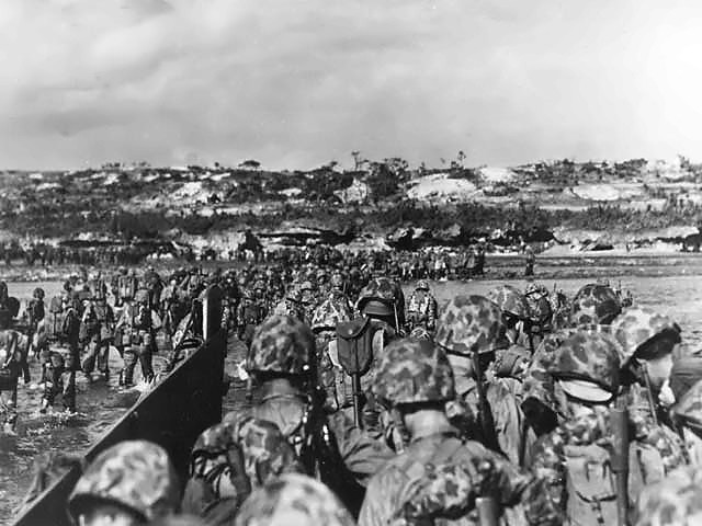 U.S. Marines land on the island of Okinawa in 1945 after a battle in which Father Lawrence Edward Lynch, a military chaplain from Woodhaven, was killed.