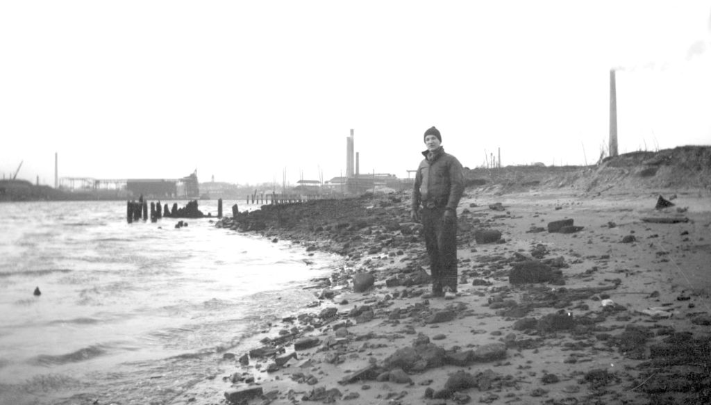 Ralph Solecki is pictured standing on the shore of Newtown Creek at Furman’s Island in Maspeth in 1937. The tributaries separating the island from Maspeth were filled in.