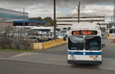 A bus exiting from the College Point Bus Depot on 28th Avenue.