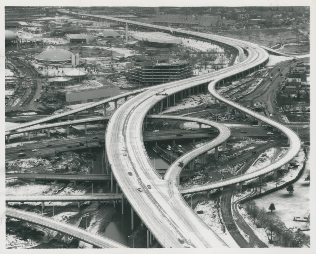 An aerial view of the Van Wyck Expressway, which covered much of where the World's Fair Railroad once ran, in 1963. (photo via Queens Library Digital Archives)