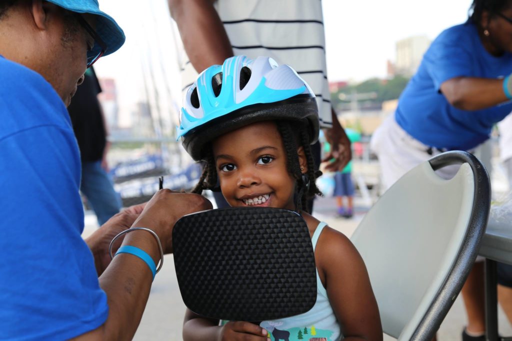 Pick up free bike helmets at a safety giveaway in Fresh Meadows this