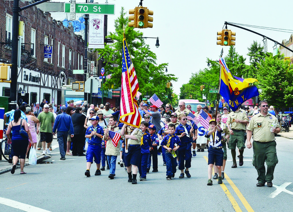 Scout troops near the corner of Myrtle and Cooper avenues in the 2013 Ridgewood-Glendale Memorial Day Parade