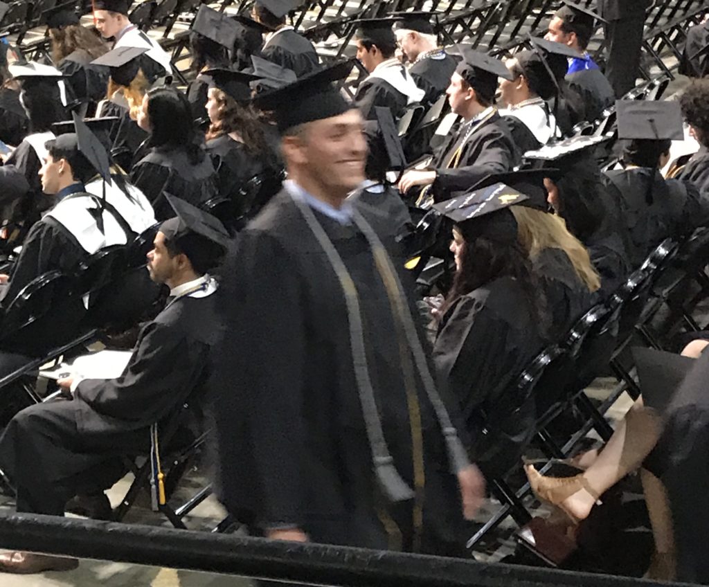 Zach marching to receive his degree