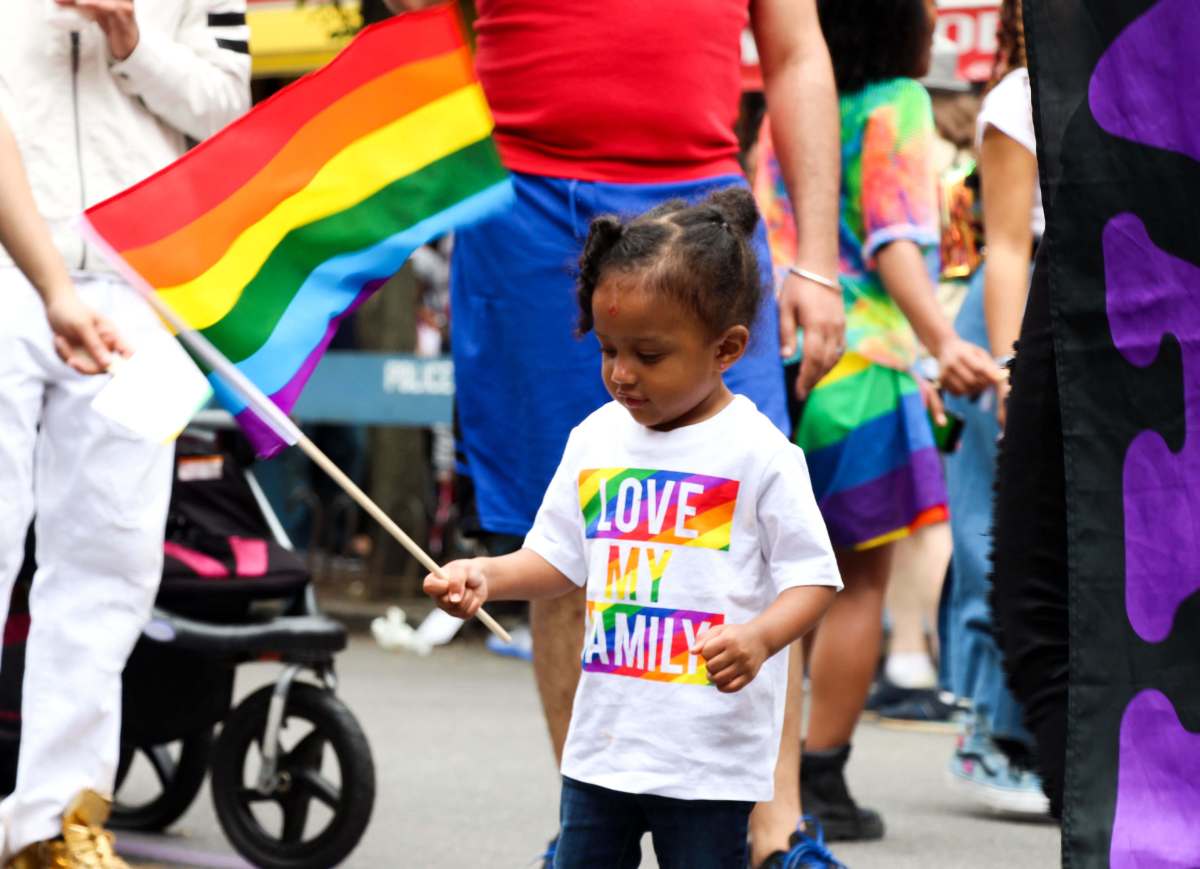 A child waves the rainbow flag during the June 3 Queens Pride Parade in Jackson Heights.