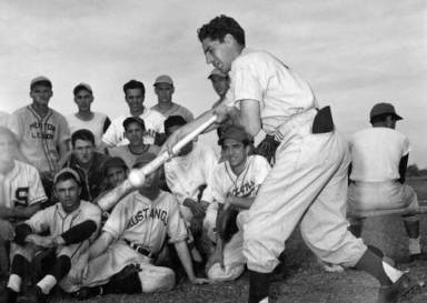 New York Yankee great and Glendale product Phil Rizzuto demonstrates bunting during a Florida camp.