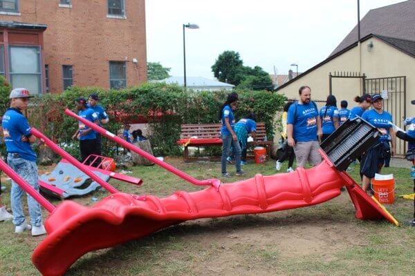 Volunteers build new playground for Merrick Academy students