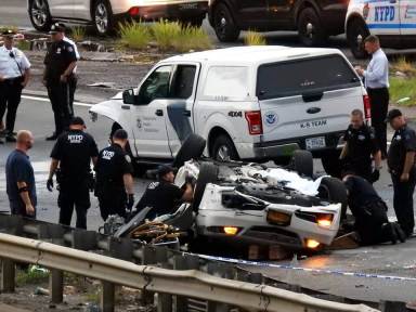 Police investigate the totaled Acura involved in a deadly, six-car pileup on the Van Wyck Expressway on Aug. 18.