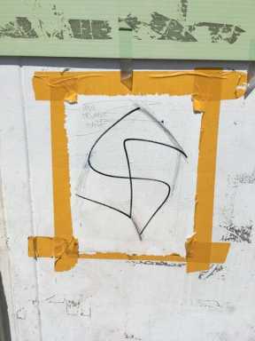 Swastika removed from Flushing BID booth