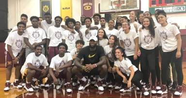 Basketball superstar LeBron James with members of Christ the King High Schools's men's and women's basketball teams in Middle Village on Sept. 4.